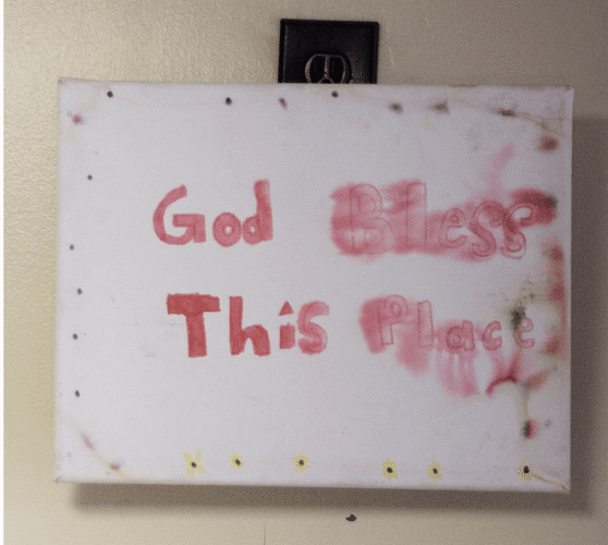 This sign, a gift from one of their first foster children, was salvaged from the tornado damage.