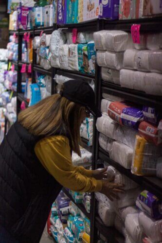 Sandra Taylor organizes their supplies for the community