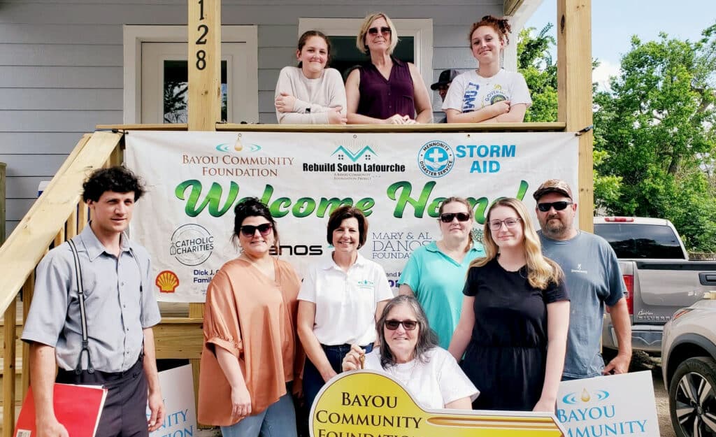 group of people in front of a house
