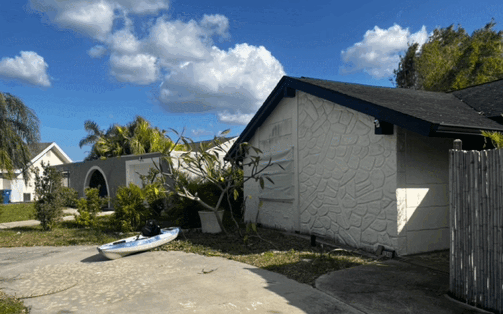 back yard shows debris from hurricane